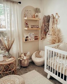 a baby's room with white furniture and decor