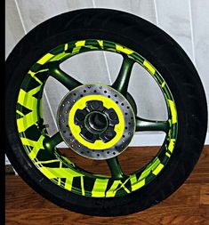 a wheel with yellow and black designs on it