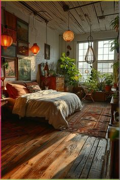 a bedroom with wooden floors and lots of plants in the window sill, along with hanging lights