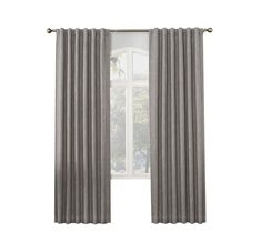 an open window with grey curtains in front of it