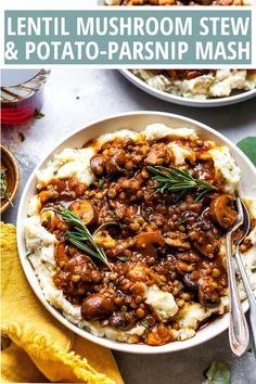 two bowls filled with mashed potatoes covered in meat and gravy next to a glass of water