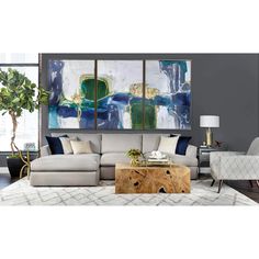 a living room with two paintings on the wall