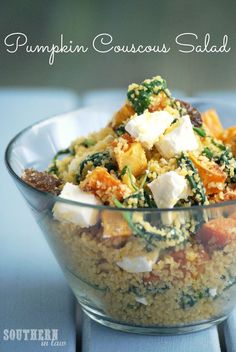 a glass bowl filled with food on top of a table