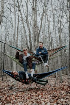 three men sitting in hammocks in the woods