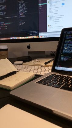 an open laptop computer sitting on top of a desk