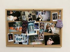 a cork board with pictures and magnets on it