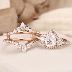 Moissanite Engagement Ring Set Moissanite Enhancer Double Wedding Band Stacking Wedding Ring Set Moissanite Halo Promise Ring For Women ✦ Handmade, high-quality item ✦ Material: SOLID 10K/14K/18K GOLD ( can be made in yellow/white/rose gold ) ✦Engagement ring ✦ Center stone: Moissanite ✦ Size/Weight: 6*8mm ✦ Color: DEF color ✦ Cut: Pear Shaped ✦ Side stones: Moissanite ✦ Weight: About 0.436ct  ✦ Color: DEF Color ✦ Cut: Round Shaped ✦ Band Width: Around 1.6mm ✦Wedding band ✦ Stones: Moissanite ✦ Pear Engagement Ring With Wedding Band Bridal Sets, Pear Shaped Ring Enhancer, Elegant Gold Bridal Sets With Intricate Design, Gold Bridal Sets With Intricate Design, Elegant White Bridal Sets With Intricate Design, Rose Gold Engagement Ring Enhancer, Pear Shaped Wedding Set, Rose Gold Moissanite Engagement Ring, Rose Gold Wedding Set