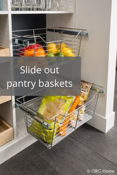 a kitchen pantry with two baskets filled with fruit and vegetables next to the bottom shelf is labeled slide out pantry baskets