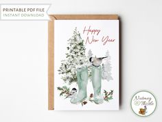 a christmas card with two boots and a bird sitting on top of it next to a tree