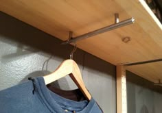 a t - shirt hanging on a clothes rack with the words grab fine diy wood projects easy christmas gifts