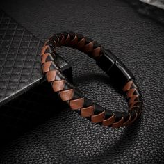 New Stylish Fashion Brown And Black Braided Leather Bracelet, Metal Magnetic Buckle Bracelet For Men. Perfect For Men Who Love Edgy And Trendy Accessories. High-Quality Material: Made Of Premium Leather And Metal, This Bracelet Is Durable And Comfortable To Wear. Easy To Wear: The Magnetic Buckle Makes It Easy To Put On And Take Off The Bracelet. Versatile: This Bracelet Is Suitable For Various Occasions, Such As Parties, Concerts, And Daily Wear. Great Gift Idea: This Bracelet Is A Perfect Gift Bracelet Metal, Buckle Bracelet, Braided Leather Bracelet, Gifts For Your Boyfriend, Mens Accessories Jewelry, Bracelet For Men, Black Braids, Trendy Accessories, Braided Leather