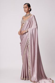 Ash pink saree crafted in satin with prism sheesha embroidery on the border. Paired with a half sleeves sweetheart neck blouse with mirror-vine embroidery. - Aza Fashions Silk Pre-draped Saree With Mirror Work For Wedding, Elegant Traditional Drape Dola Silk Saree, Elegant Pre-draped Dola Silk Saree For Reception, Festive Silk Pre-draped Saree For Reception, Festive Satin Pre-draped Saree, Silk Blouse Piece For Reception With Traditional Drape, Elegant Dola Silk Blouse Piece For Reception, Satin Pre-draped Saree With Pallu For Wedding, Festive Pre-draped Silk Saree For Reception