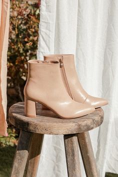 The Lulus Sarai Light Nude Pointed-Toe Ankle Booties are our new fav fall essential! Smooth vegan leather shapes these chic boots that feature a pointed-toe upper and ankle-grazing shaft, all atop a trendy block heel. Side zipper with gold pull-tab for easy on and off. 3" Wrapped Block Heel. Cushioned Insole. Nonskid Rubber Sole. All Man Made Materials. Imported. Lulus | Sarai Light Nude Pointed-Toe Ankle Booties | Beige | Vegan Friendly. Chic High Ankle Booties For Fall, Chic Faux Leather Booties For Fall, Fall Workwear Booties With Pointed Toe, Beige Pointed Toe Heeled Boots For Fall, Fall Faux Leather Booties With Stacked Heel, Beige Pointed Toe Heeled Boots In Faux Leather, Beige Pointed Toe Faux Leather Heeled Boots, Beige Ankle Boot Heeled Boots For Fall, Beige Faux Leather Boots For Work