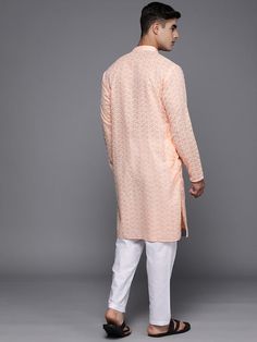 Peach-coloured embroidered Kurta with TrousersKurta design:Ethnic motifs embroideredStraight shapeRegular styleMandarin collar, long regular sleeves2 pockets chikankari detailCalf length with straight hemCotton blend machine weave fabricTrousers design:Solid TrousersPartially elasticated waistbandHook and eye closure Peach Long Sleeve Sets With Zari Work, Peach Kurta With Zari Work And Long Sleeves, Peach Kurta With Zari Work, Spring Sherwani With Chikankari Embroidery And Long Sleeves, Long Sleeve Sherwani With Chikankari Embroidery For Spring, Spring Sherwani With Resham Embroidery And Long Sleeves, Spring Sherwani With Resham Embroidery, Long Sleeve Peach Kurta With Zari Work, Peach Long Sleeve Kurta With Zari Work