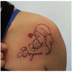 a woman with a tattoo on her shoulder that says, be my babyannn