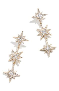 Ignite your look, day or night with these triple star drop earrings filled with pavé crystals. 2 1/4" drop; 3/4" width Surgical steel post back Goldtone plate/glass Imported Star Drop Earrings, Bridal Earrings Studs, Gold Star Earrings, Ups Shipping, Safety Pin Earrings, 18k Gold Necklace, 18k Gold Earrings, Statement Drop Earrings, Party Earrings