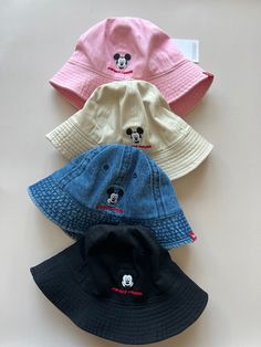 Disney Mickey Mouse baby toddler bucket hats in four colors Disney Bucket Hat Outfit, Fun Mickey Mouse Hat, Casual Cotton Hats With Mickey Mouse Detail, Mickey Bucket Hat, Disney Hats For Boys, Casual Cotton Mickey Mouse Hats, Disney Baseball Hat, Adjustable Cotton Mickey Mouse Hat, Mouse Logo