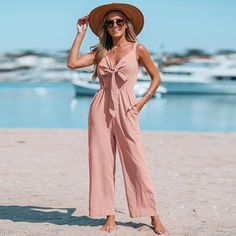 This Cotton Bow V-Neck Jumpsuit features wide straps, a straight leg, and a long playsuit silhouette, perfect for the summer season. This stylish jumpsuit is ideal for women, with its form-flattering design and romper styling. Transitioning from day to night is effortless in this timeless piece. Create chic, stylish looks with the versatility of this breathable jumpsuit. SPECIFICATIONS Wash Method: Regular Wash Waist Type: HIGH Type: Jumpsuits Thickness: Thin Style: Casual Pattern Type: Solid Pa V Neck Jumpsuit, Wide Leg Romper, Cute Rompers