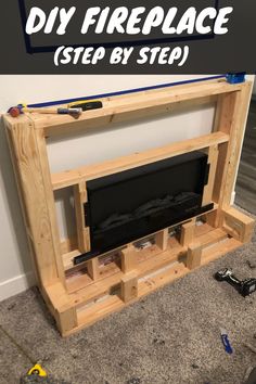 a diy fireplace made out of pallet wood with text overlay that reads, diy fireplace step by step guide