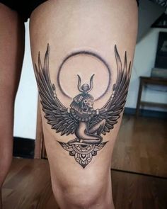 a woman's leg with an angel tattoo on it