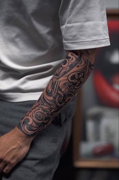 a man with a tattoo on his arm