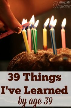 someone lighting candles on a cake with the words 39 things i've learned by age 39