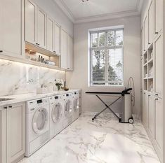 a laundry room with washer and dryer in it