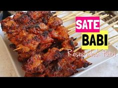 barbecue skewers are on a white plate with the words safe babi above them