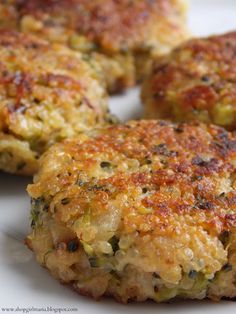 four crab cakes on a white plate ready to be eaten