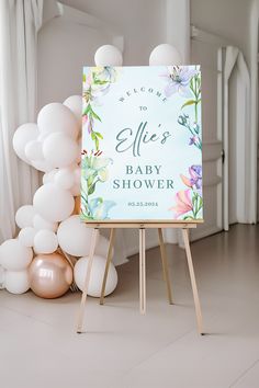 a baby shower sign surrounded by balloons