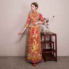 Indulge in the opulent elegance of this 2-piece qun kwa set, embellished with luxurious gold and silver embroidery. The exquisite detailing of dragons, phoenixes, flowers, and lucky clouds graces both the jacket and skirt, while shimmering crystals provide a dazzling touch for an unforgettable ensemble at your tea ceremony. Please note Asian size run small, refer to the size chart in the picture. Please leave Height, Weight and Bust measurements in the Personalisation box so you can double check Wedding Dress Slim, Qun Kwa, Chinese Bride, Bride Wedding Dress, Dragon Phoenix, Qipao Cheongsam, Silver Embroidery, Phoenix Wedding, Dress Slim