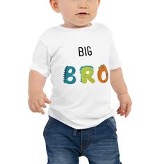 Help your kiddo celebrate his new brother or sister (or even pet!) with a dino BIG BRO tshirt! It's never too early to look great! So get your baby this short sleeve cotton jersey tee that's not only stylish, but also comfy, durable, and easy to clean. It's a classic that's bound to become the most loved item in your baby's wardrobe.  * 100% combed ring-spun cotton * Heather colors are 52% combed ring-spun cotton, 48% polyester * Fabric weight: 4.2 oz/yd² (142 g/m²) * Pre-shrunk fabric * 32 singles * Relaxed fit * Side-seamed construction * Blank product sourced from Nicaragua, the US, or Honduras This product is made especially for you as soon as you place an order, which is why it takes us a bit longer to deliver it to you. Making products on demand instead of in bulk helps reduce overpr Fun Short Sleeve T-shirt With Dinosaur Print, Dinosaur Print Short Sleeve T-shirt For Birthday, Birthday Dinosaur Print Short Sleeve T-shirt, Birthday T-shirt With Dinosaur Print, Cute Cotton Dinosaur Print T-shirt, Fun Short Sleeve Dinosaur Print T-shirt, Funny Dinosaur Print Short Sleeve T-shirt, Jersey Tee, Kids Tops