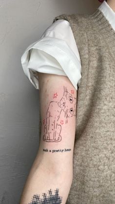 a person with a cat tattoo on their arm