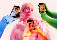 three people holding up cell phones in front of their faces, with one person wearing blue gloves