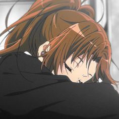 an anime character with long red hair hugging another person's head in front of him