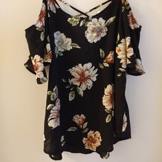 Nwt Size Medium Black And Floral Off The Shoulder Short Flutter Sleeved Blouse. Cute X Strap Scoop Back Detail. Polyester, Spandex Washable Material Casual Black Flowy Blouse, Black V-neck Rayon Blouse, Black Spring Vacation Blouse, Black Blouse For Spring Vacation, Casual Black Flowy Tops, Black Cold Shoulder Summer Blouse, Black Cold Shoulder Blouse For Summer, Black Floral Print Vacation Blouse, Stretch Floral Print Blouse For Brunch