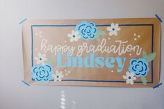 there is a sign that says happy graduation lindsey on the side of a refrigerator door