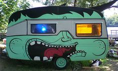 a camper with an angry face painted on the side