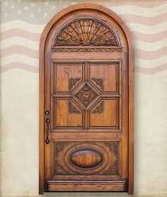 a wooden door with an american flag in the background