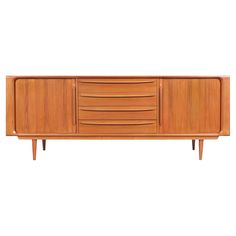 the sideboard is made from wood and has three drawers on each side, one door open