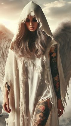 a woman with tattoos standing in front of an angel