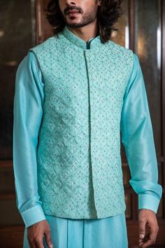 Shop for Darshika Menswear Blue Silk Blend Hand Embroidered Bundi And Kurta Set for Men Online at Aza Fashions Fitted Cutdana Outerwear For Festivals, Fitted Outerwear With Cutdana For Festivals, Blue Nehru Jacket With Chikankari Embroidery For Festivals, Festive Fitted Outerwear With Chikankari Embroidery, Fitted Chanderi Bandhgala For Festivals, Fitted Chikankari Embroidery Outerwear For Festivals, Blue Chanderi Nehru Jacket For Designer Wear, Designer Nehru Jacket With Mirror Work For Festivals, Fitted Chanderi Nehru Jacket For Festive Occasions