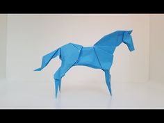 an origami horse is shown in blue