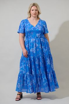 Summer afternoons were made for an adorable dress like the Selma Floral Alexis Poplin Tiered Midi Dress. Tiered layers take on this lovely blue floral dress that with a smocked design on the sides and short sleeves with a v neckline. Dress is up with any heels or sandals. - V-neck- Tiered- Puff sleeves- Smocked- Color: Cobalt Blue Size + Fit - Model is 5'10" and wearing size 2X- Measurements taken from size 2X- Chest: 22 1/2"- Length: 58 1/2" Fabric Self: 100% Cotton, Lining: 97% Polyester 3% Sp V Neckline Dress, Blue Floral Dress, Neckline Dress, Tiered Midi Dress, African Dresses, African Dresses For Women, Floral Blue Dress, Cotton Voile, Off Black