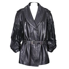 Claude Montana Moto Jacket with long fringe detailing falling from shoulder and back yoke. Double breasted with oversized shawl collar and long silver zipper ornamentation. The original belt is missing and needs one to stay closed. A simple leather tied or buckled belt will work. The jacket is styled with both Western and Leather influences, which Montana referenced heavily throughout his career. Oversized shoulders are also a trademark and the cuffs can worn open or closed with snaps (as shown) 90s Blazer, Claude Montana, Fringe Leather Jacket, Simple Leather, Long Fringes, Fringe Jacket, Double Breasted Jacket, Leather Jacket Black, Leather Motorcycle Jacket