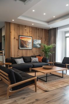 a living room with wood paneling and black furniture