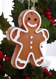 a ginger ornament hanging from a christmas tree