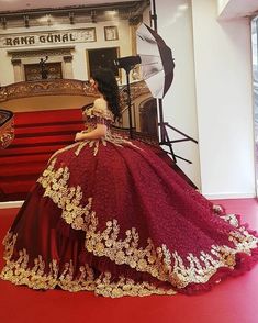 Quince Red Dress With Gold, Red And Gold Wedding Tuxedo, Quincenera Dresses Maroon, Maroon 15 Dresses Quinceanera, Red Flower Quinceanera Dresses, Red Quinceanera Dresses Long Sleeve, Burgundy Quinceanera Dresses Mexican, Red Gold Quince Dress, Burgundy Xv Dresses