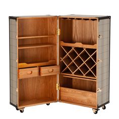 an open wooden wine rack on wheels with shelves and drawers in the middle, against a white background