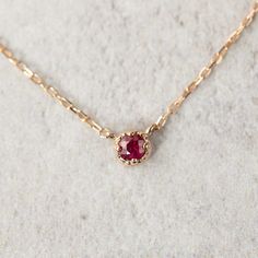 Elegant Ruby Necklace In Rose Gold, Elegant Rose Gold Ruby Necklace, Rose Gold Ruby Birthstone Necklace, Red Ruby Necklace With Bezel Setting, Red 14k Gold Round Pendant Birthstone Necklace, Red 14k Gold Birthstone Necklace With Round Pendant, Red Birthstone Necklace In 14k Gold, Solitaire Birthstone Necklace In 14k Rose Gold, Subtle Necklace